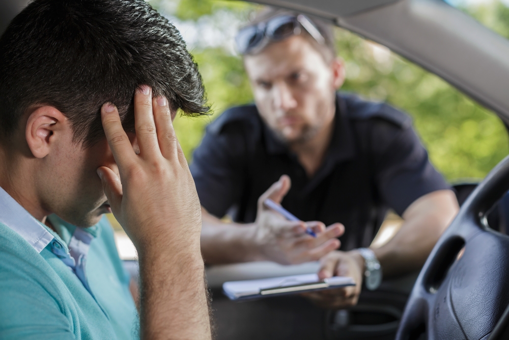 man pulled over by a police officer